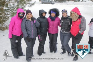 MLK Ski Weekend 2016 group photo of ladies posing outside in winter gear doing snow tubing