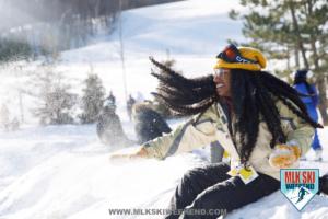 MLK Ski Weekend snow everywhere at ski resort girl with long hair throwing snow ball